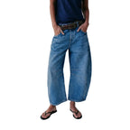 Dark blue baggy jeans stone washed fabric texture