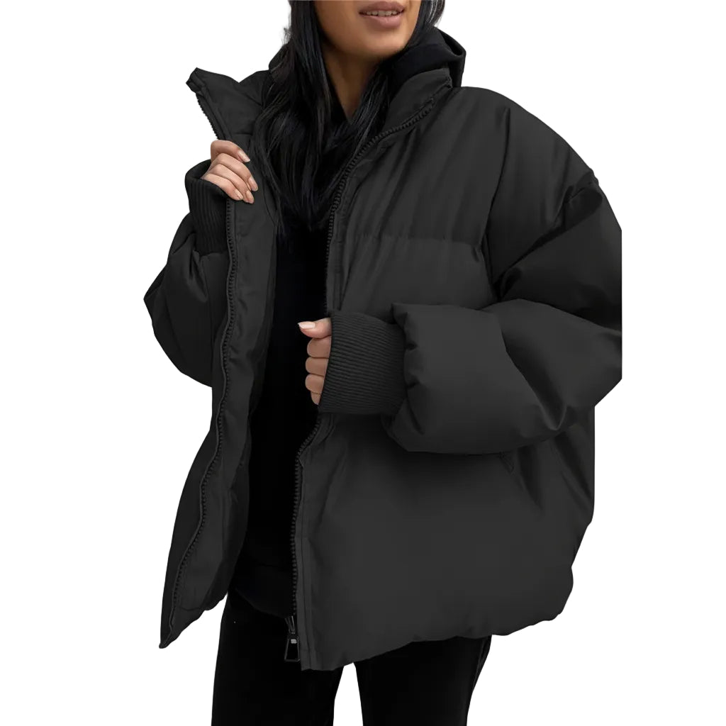 Person wearing a black puffer jacket against a white background
