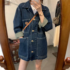 Person wearing a denim jacket in front of a mirror