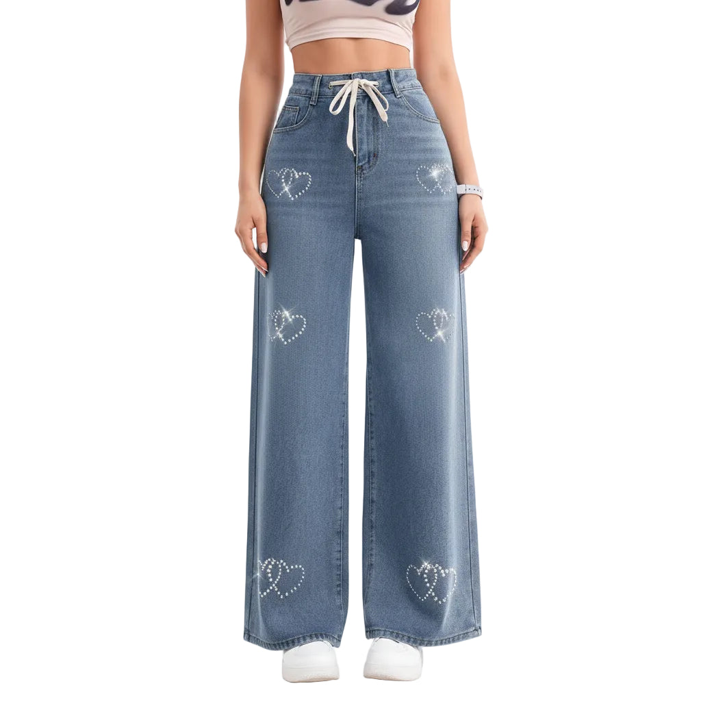 Wide-leg denim pants with heart patterns worn by a person indoors.