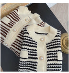 Knitted cardigans with striped pattern on a dark surface