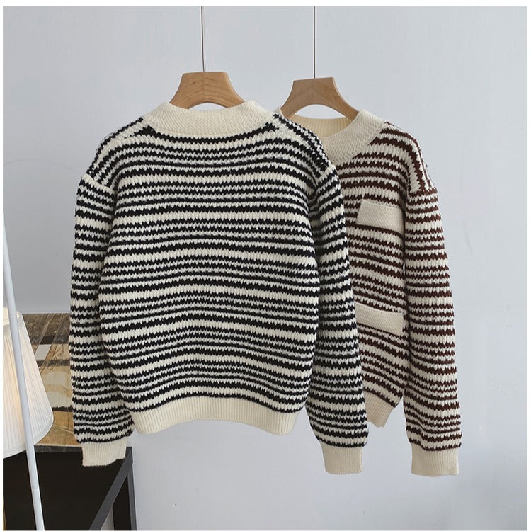 Knitted cardigans with striped pattern on a dark surface