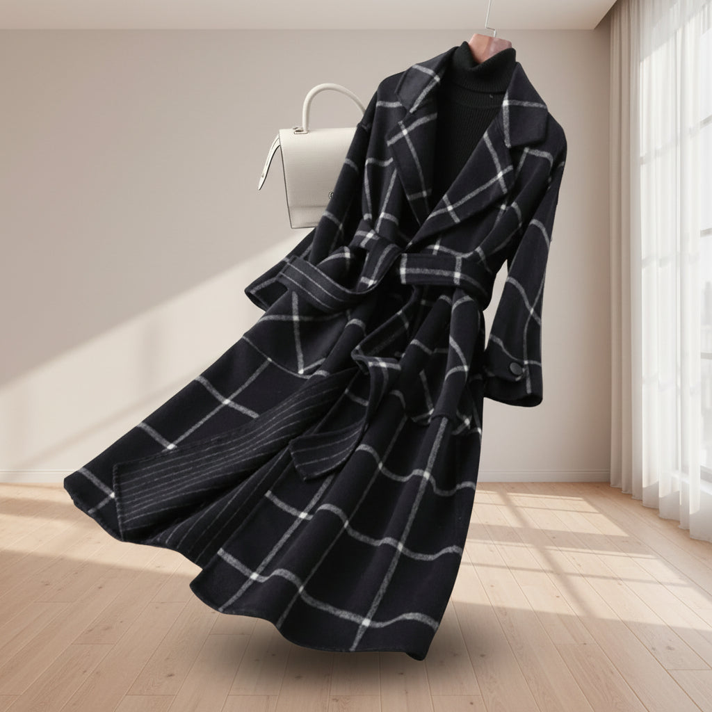 Black and white plaid coat on a light gray background