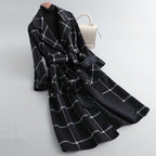 Black and white plaid coat on a light gray background