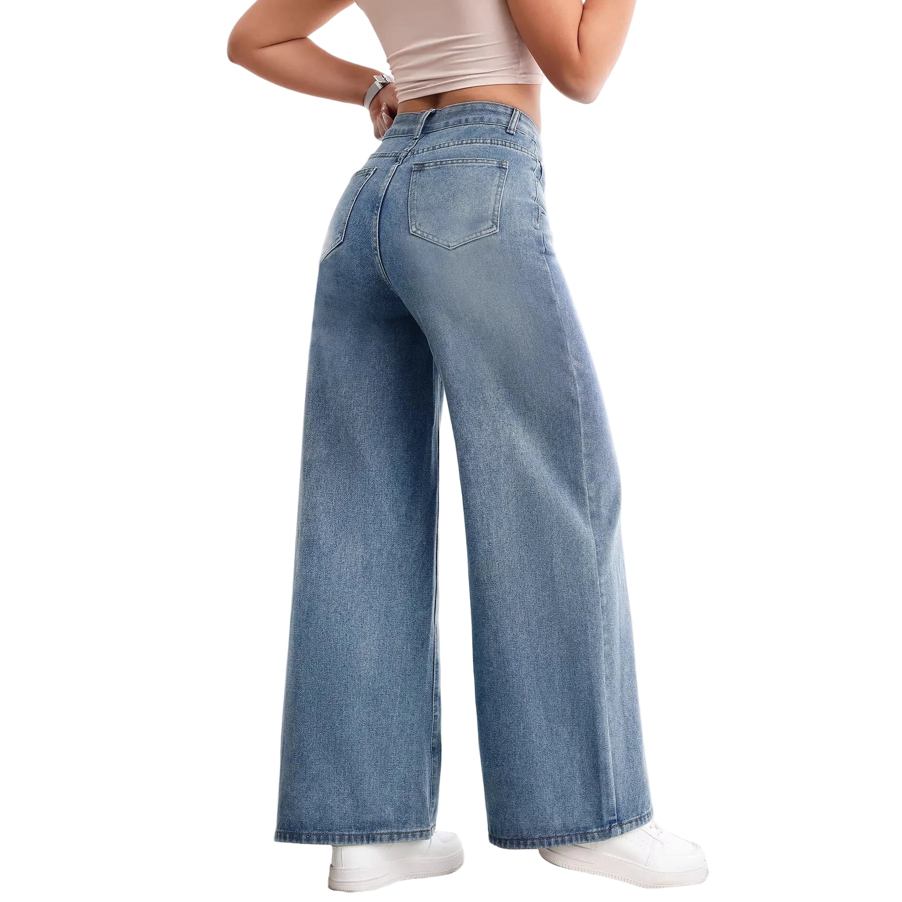 Person wearing light blue wide-leg jeans in a minimal indoor setting