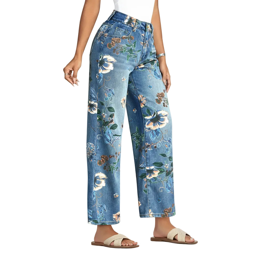 Person wearing floral jeans standing on a stone path.